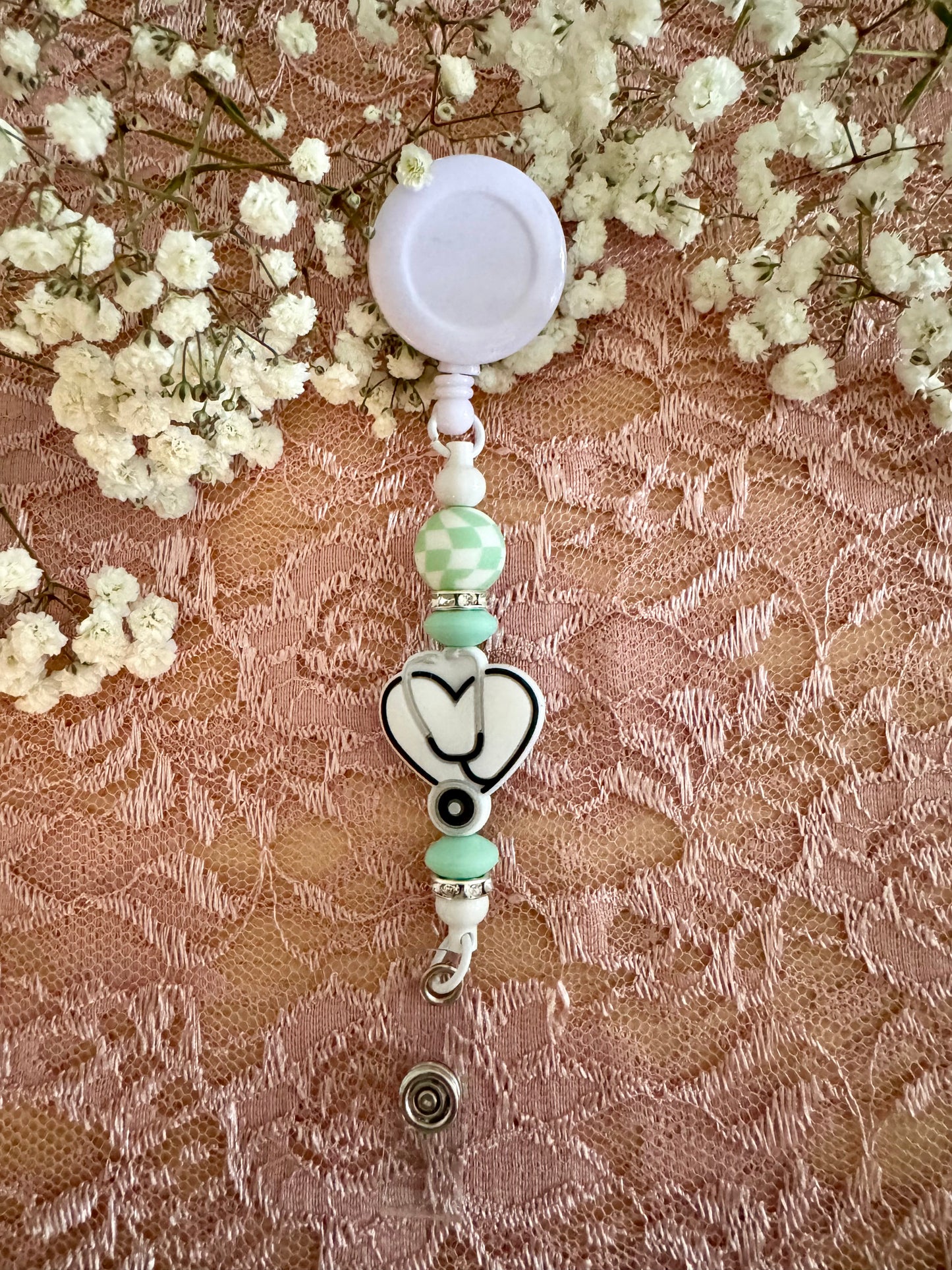 White Stethoscope with Teal Badge Reel